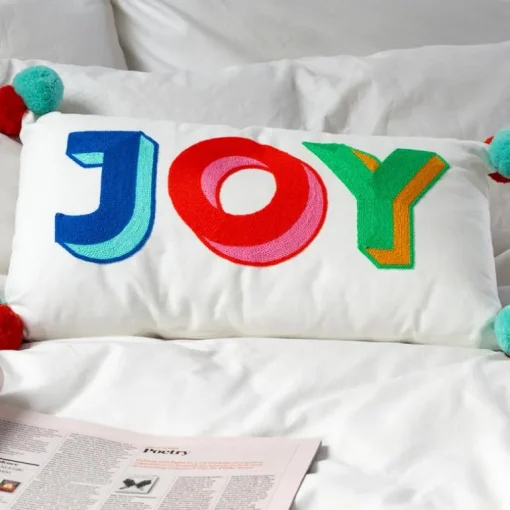Embroidered cushion with pom poms - Joy