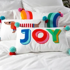 Embroidered cushion with pom poms - Joy