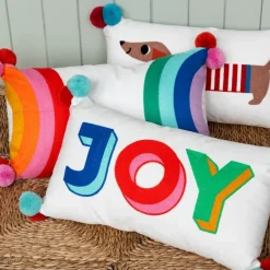 Embroidered cushion with pom poms - Joy