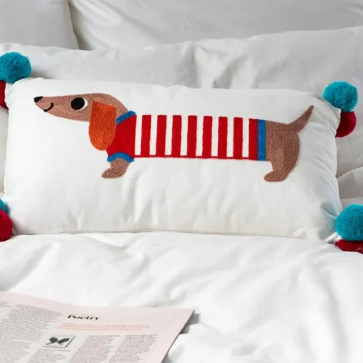 Embroidered cushion with pom poms - Sausage Dog