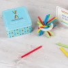 Wooden pick up sticks in a tin